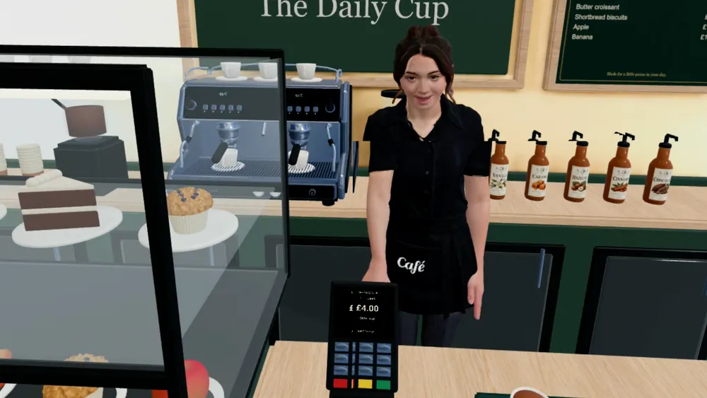 Learner's view of the café counter, staff member and card reader in CorteXR Studio